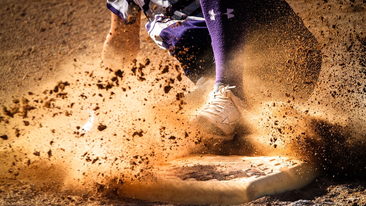 Softball player sliding AUSL coaches and general managers