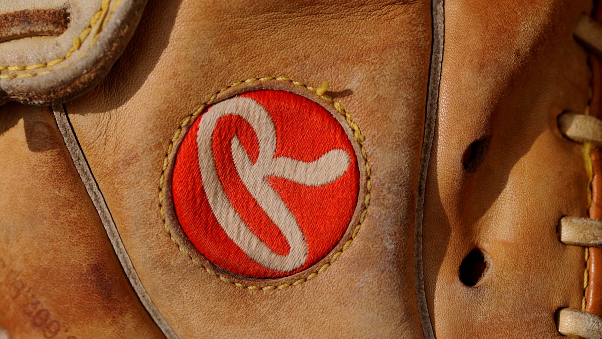 Softball player running bases AUSL host cities