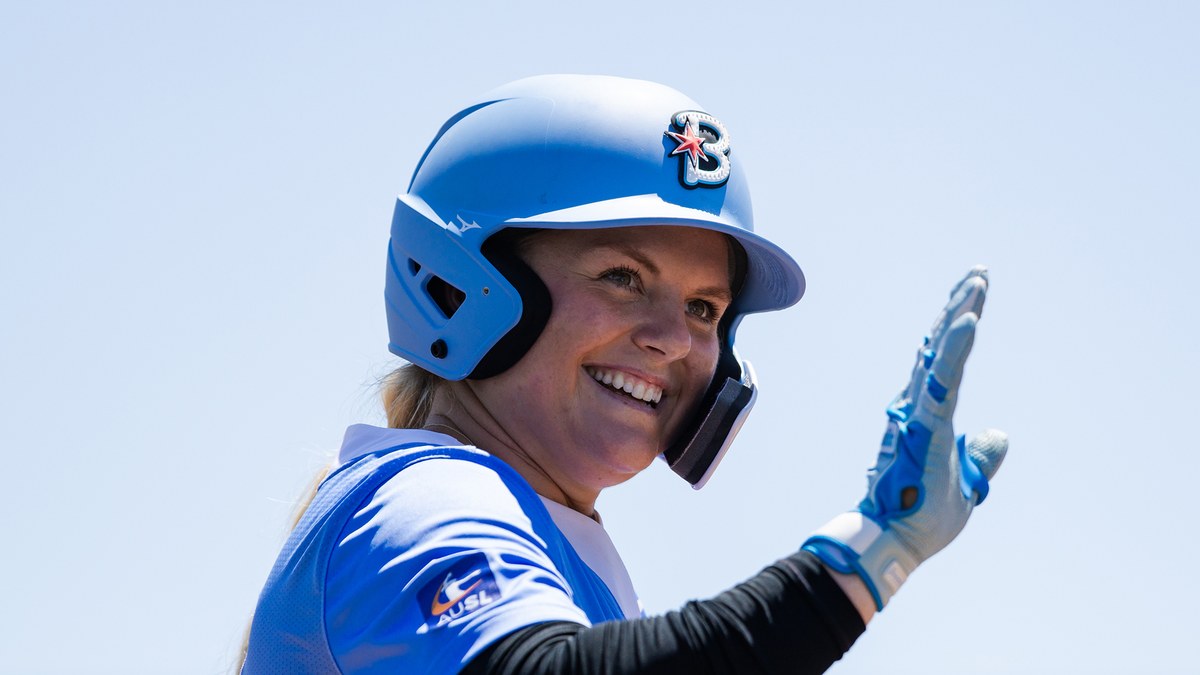 Chicago Bandits infielder Erin Coffel waves while wearing a batting helmet