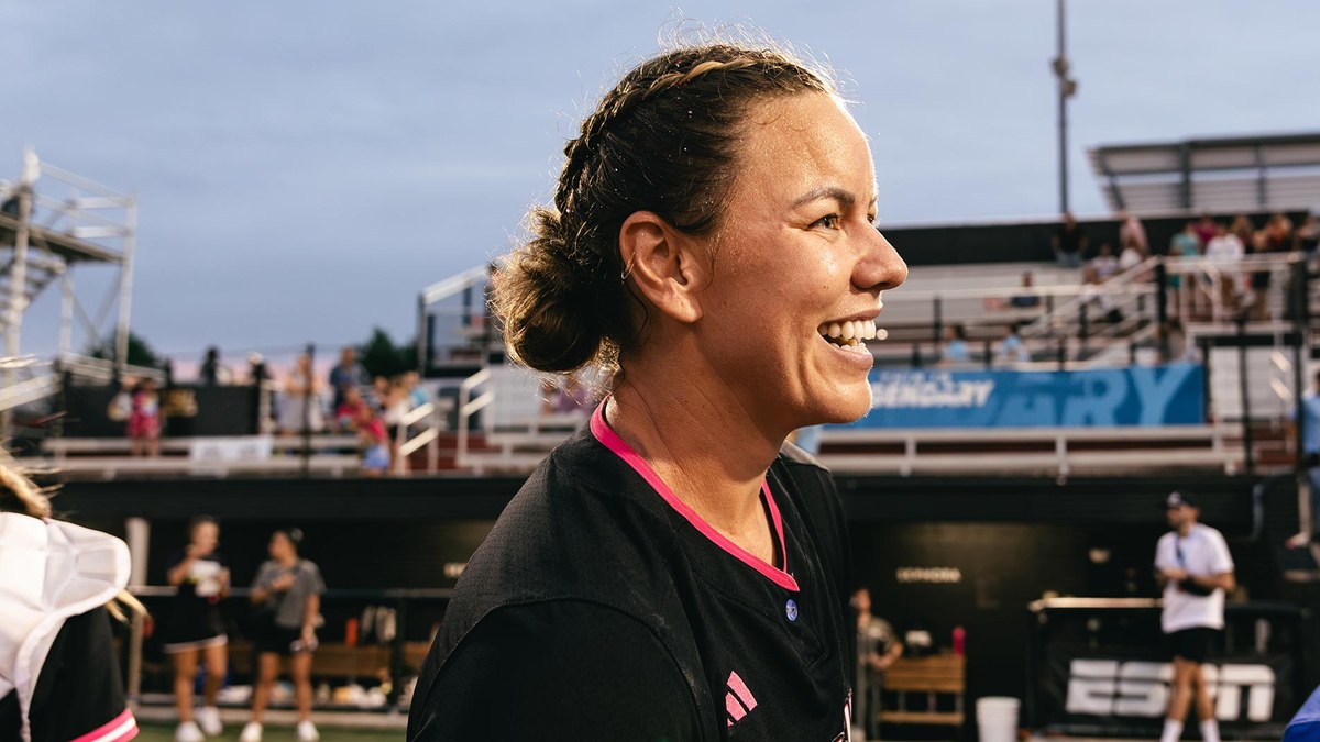 Carolina Blaze pitcher Keilani Ricketts-Tumanuvao smiles on the field in a black Blaze shirt