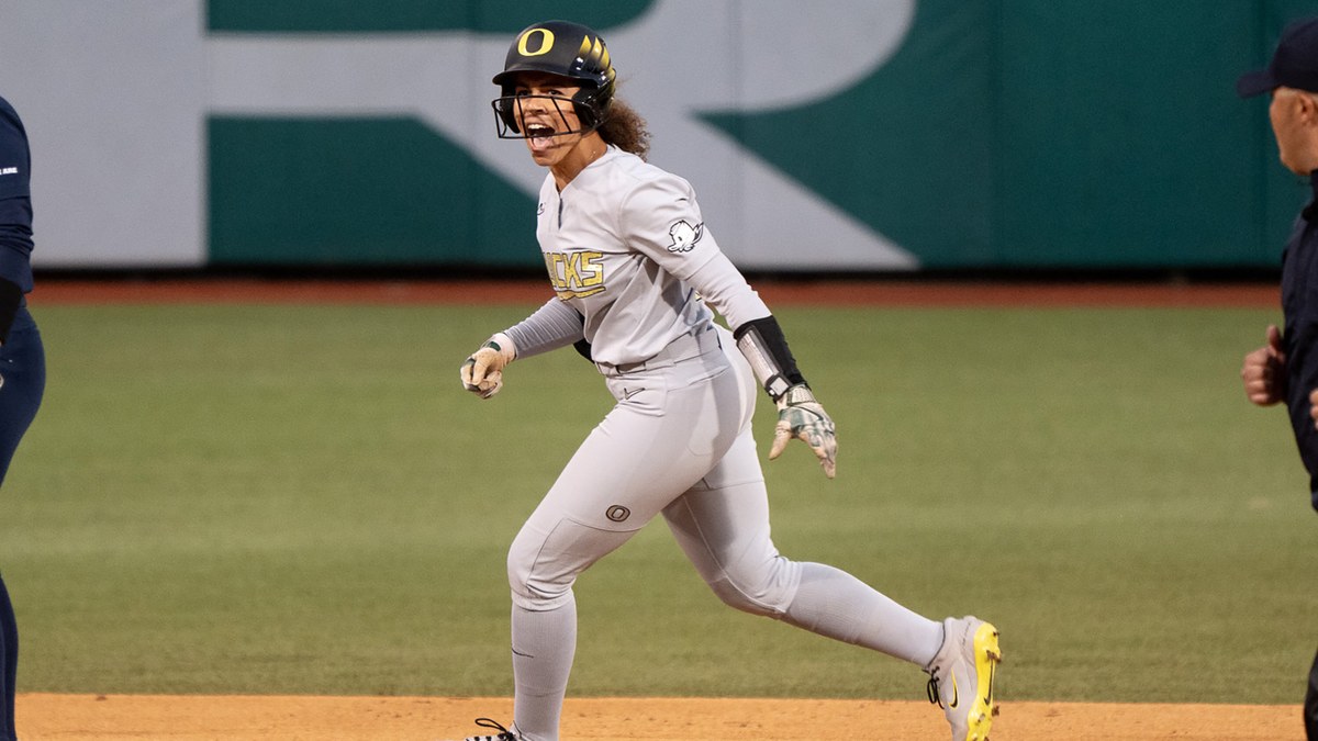 Oregon's Amari Harper celebrates on the bases