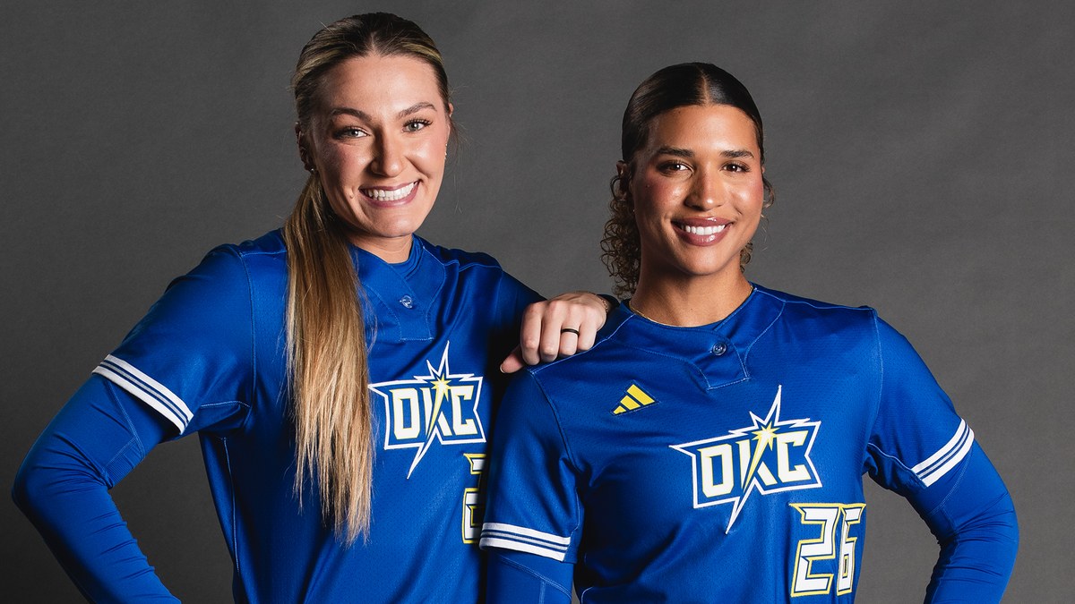 Two Oklahoma City Spark players in the 2026 royal blue road uniform
