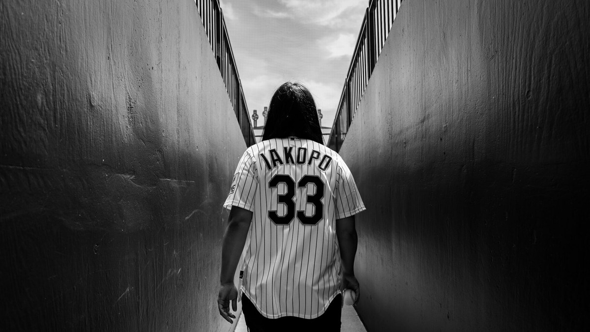 Mary Iakopo walks down the tunnel at Rate Field in a White Sox No. 33 Iakopo jersey
