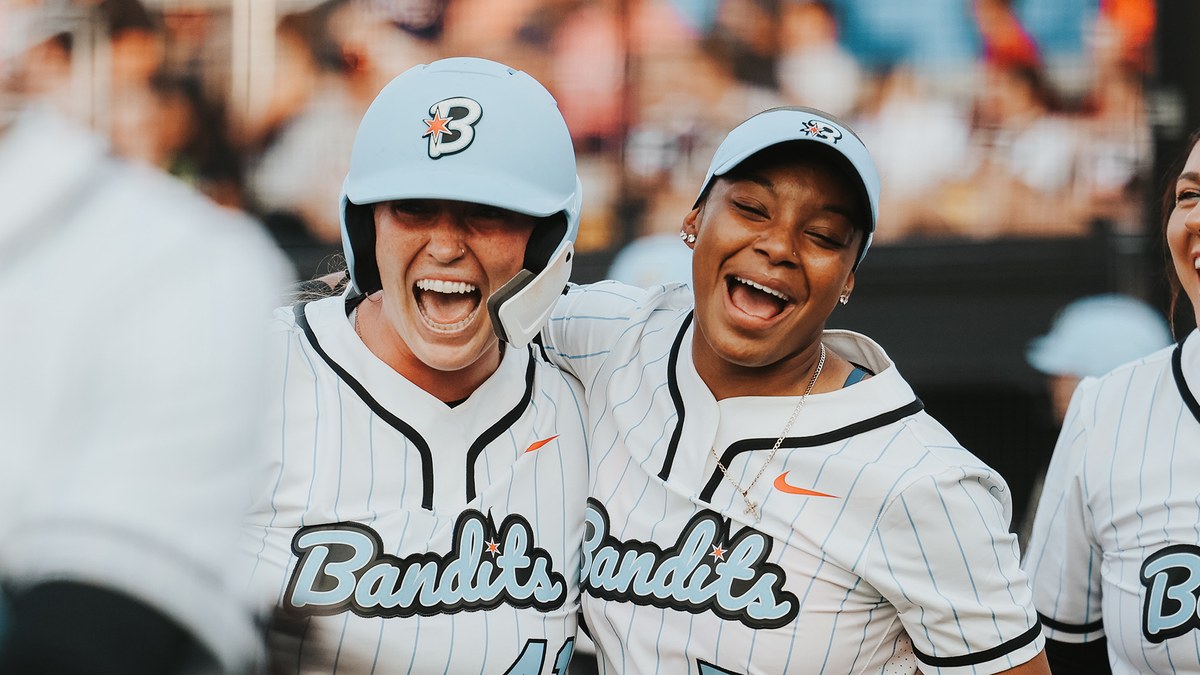 Chicago Bandits players celebrate in 2025 pinstripe uniforms