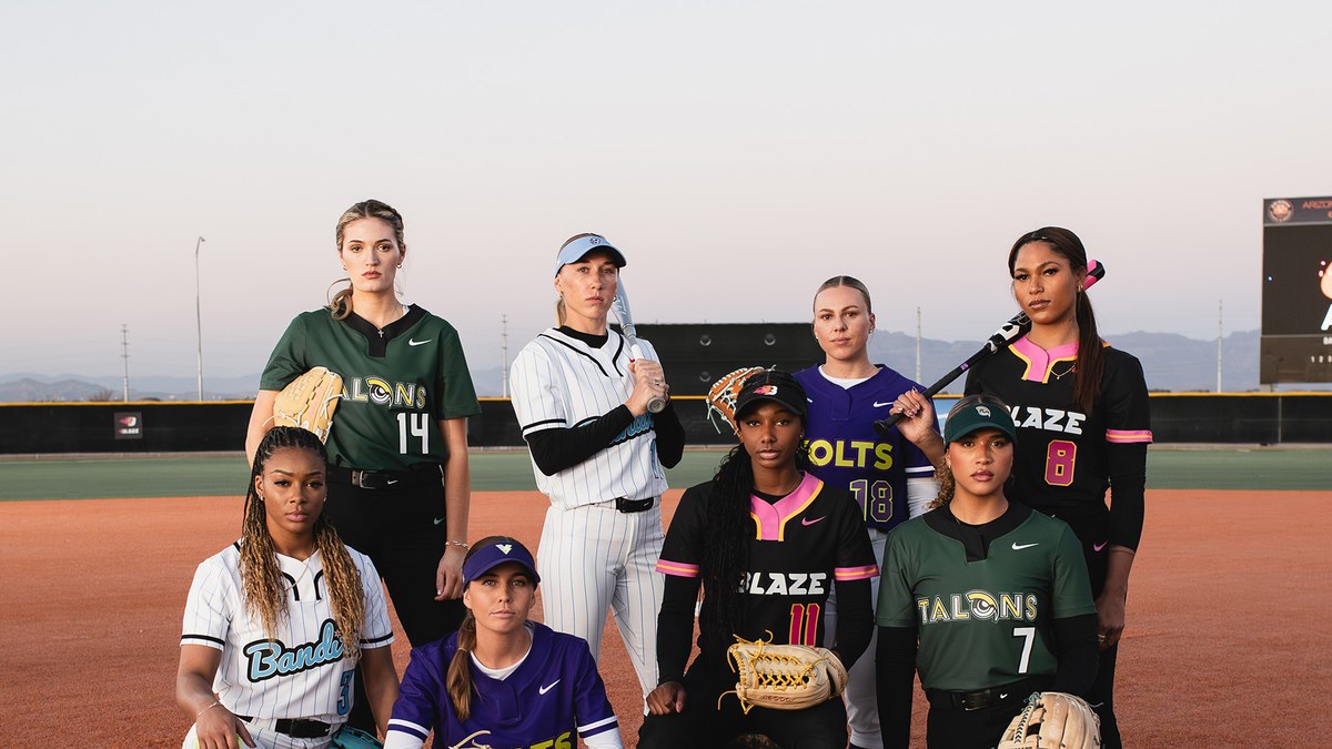 Players in the four 2025 AUSL team uniforms posed on a softball field
