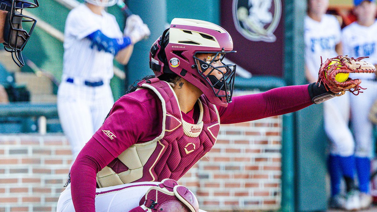 Florida State catcher Michaela Edenfield receives a pitch