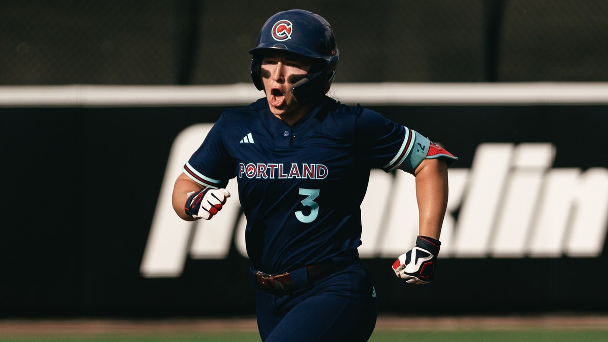 Portland Cascade outfielder Korbe Otis runs the bases in a navy Portland No. 3 jersey