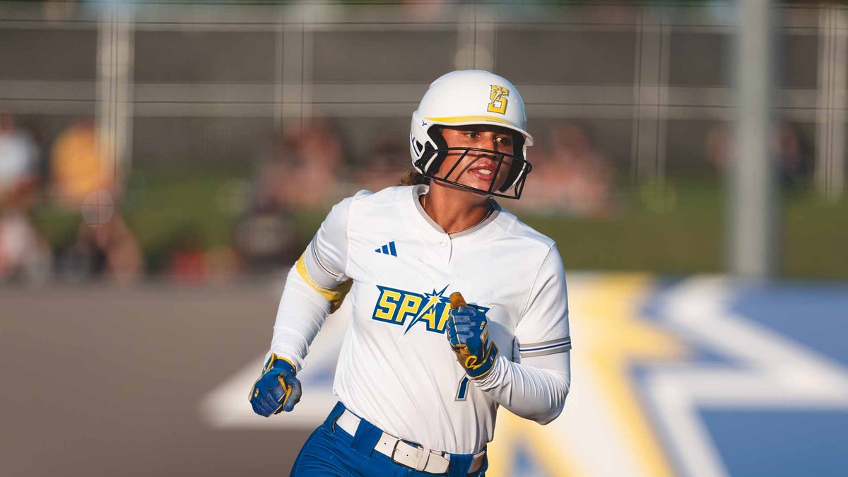 Oklahoma City Spark outfielder Maya Brady runs the bases in a white Spark uniform