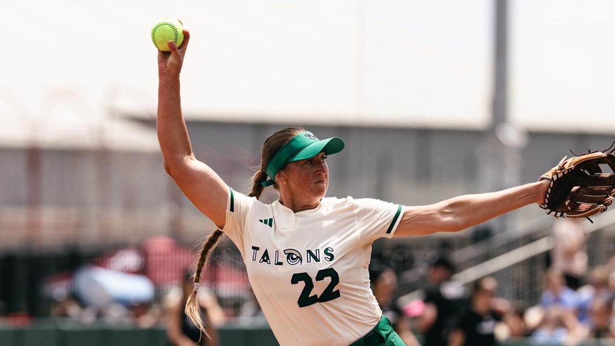 Utah Talons pitcher Georgina Corrick, No. 22, winds up to deliver a pitch in a white Talons uniform and green visor