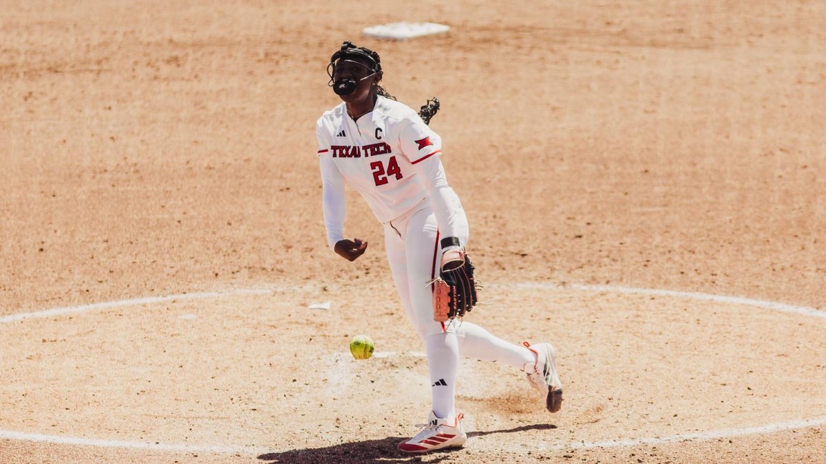 Texas Tech pitcher NiJaree Canady, No. 24, delivers a pitch in a white Red Raiders uniform