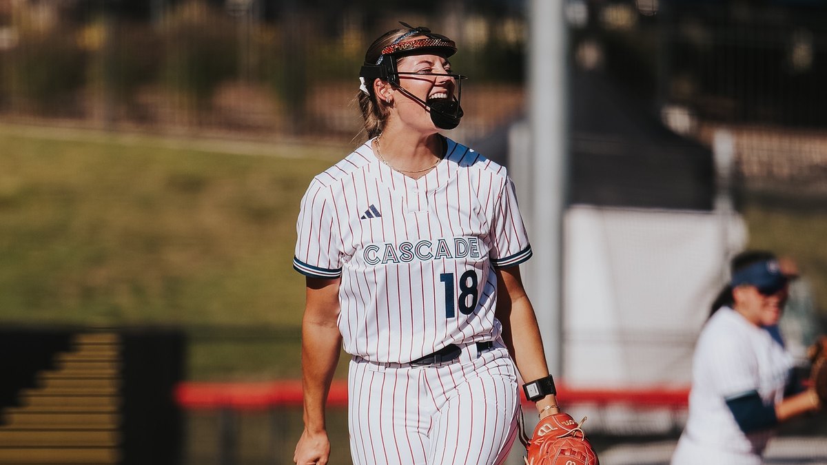 Portland Cascade pitcher Kenzie Brown, No. 18, celebrates on the mound in a pinstriped Cascade uniform