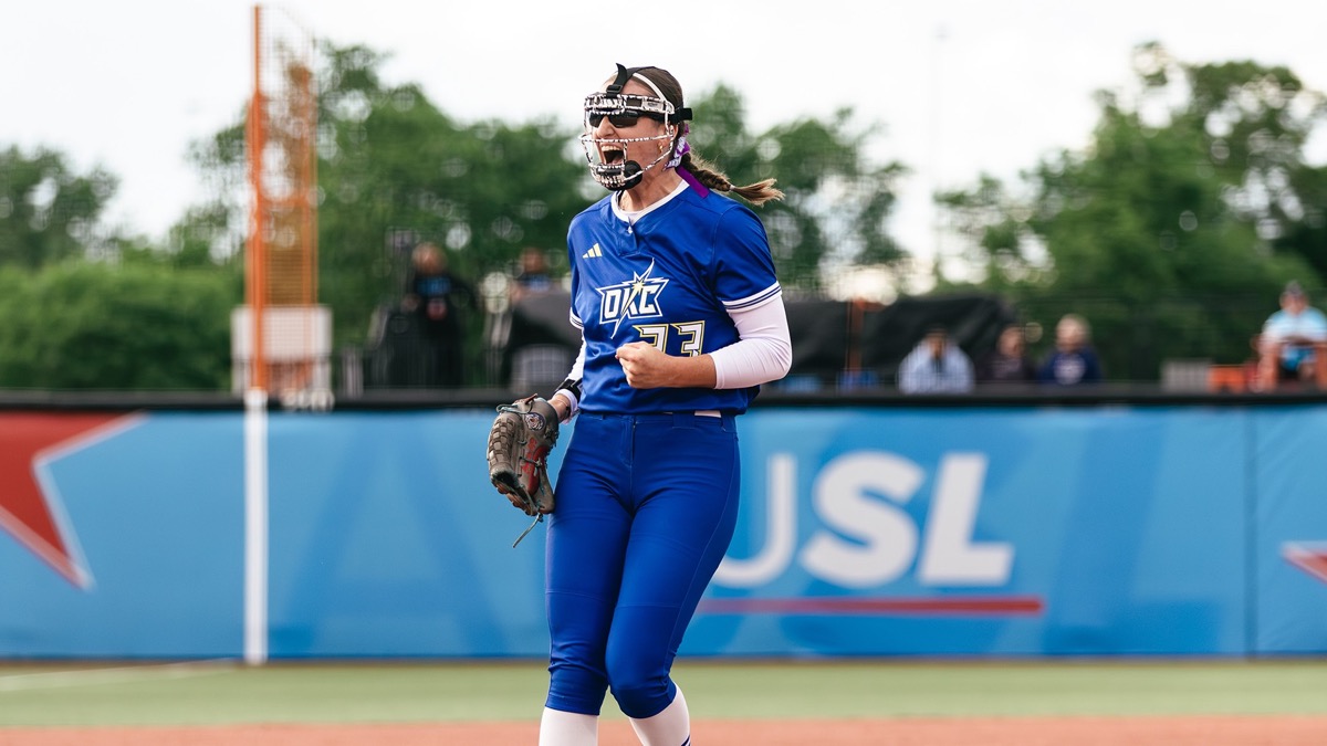 Oklahoma City Spark pitcher Maya Johnson, No. 23, celebrating in the circle in a blue Spark uniform