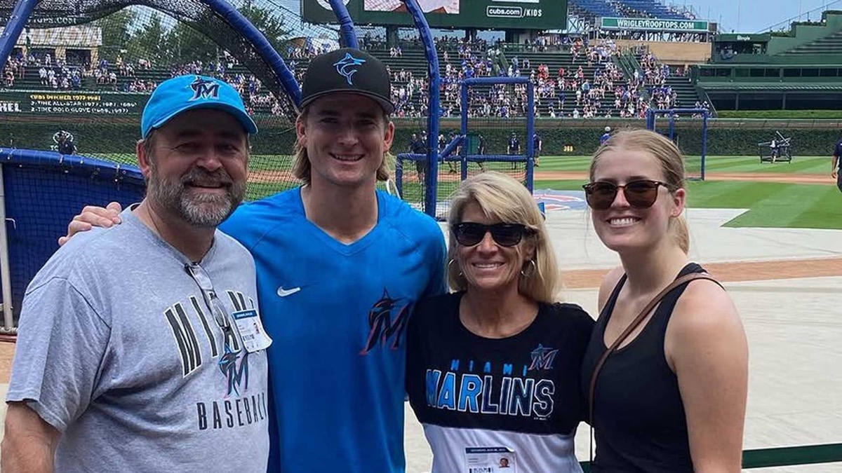 Sami Williams and her brother Luke Williams with their parents on the field at Wrigley Field